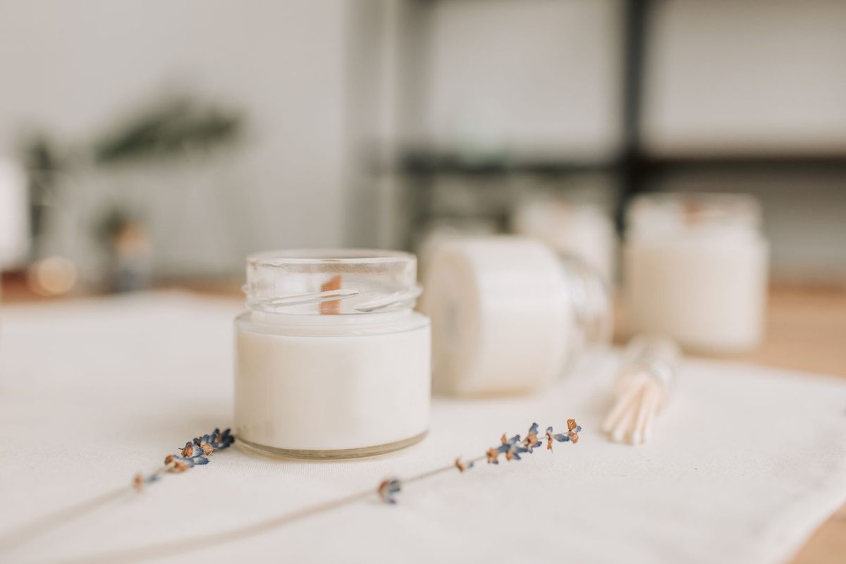 Candles and dried flowers in soft light