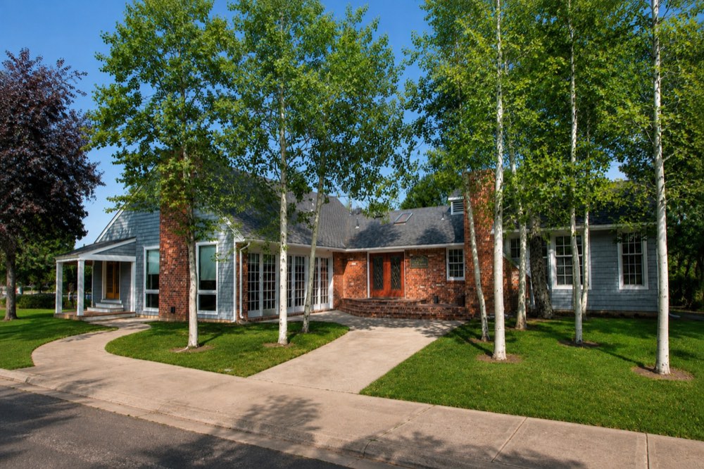 The Venya Therapeutics building on Park Lane in Lafayette, Colorado: a cedar-shingled house set back among aspens