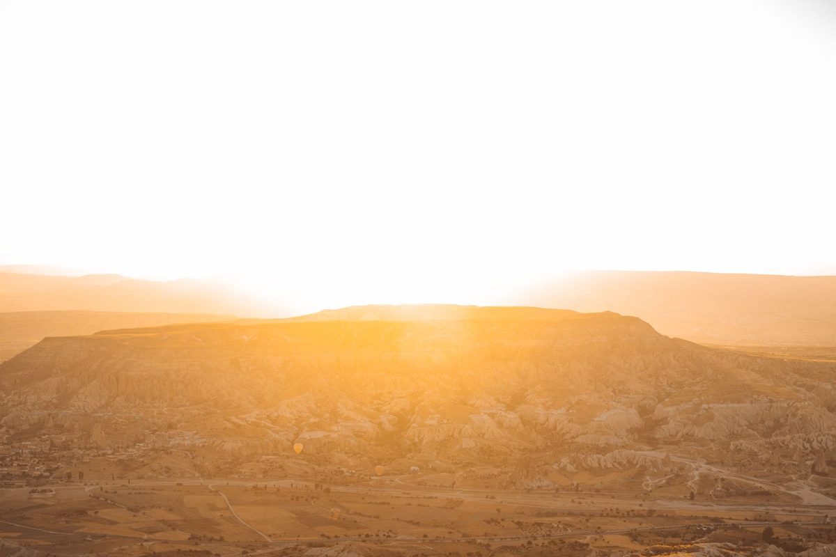 A soft sunrise over the mountains